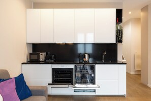 Leilighet – deluxe, byutsikt | Eget kjøkken | Kjøleskap, mikrobølgeovn, ovn og kokeplater