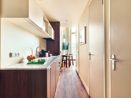 Large Studio with Kitchen | Private kitchen | Fridge, microwave, stovetop, dishwasher