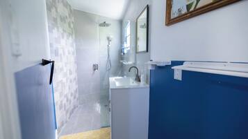 Shower, towels, soap, toilet paper