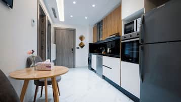 Deluxe Apartment, 1 Bedroom, Beachside | Private kitchen | Fridge, oven, stovetop, dishwasher