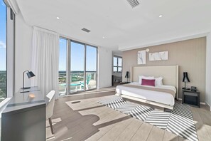 Bedroom 2 with queen bed, balcony, and esuite