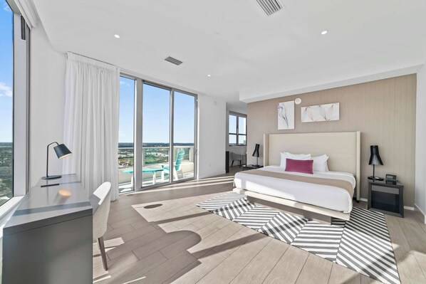 Bedroom 2 with queen bed, balcony, and esuite