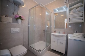 Shower, hair dryer, towels, soap