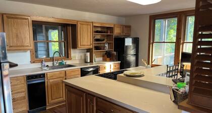 Spacious family home on the banks of the Little Red River in Heber Springs AR.