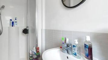 Apartment | Bathroom | Separate tub and shower, deep soaking tub, towels, toilet paper