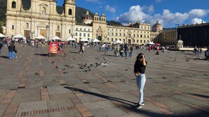 A spacious plaza with a historic building featuring multiple towers and domes. - Hotel Suite Centro Bogota (Bogotá)