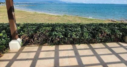 Relax by the pool with the sounds of waves and enjoy ocean and mountains views