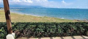 Relax by the pool with the sounds of waves and enjoy ocean and mountains views