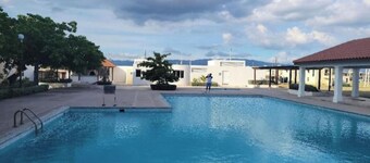 Relax by the pool with the sounds of waves and enjoy   ocean and mountains views