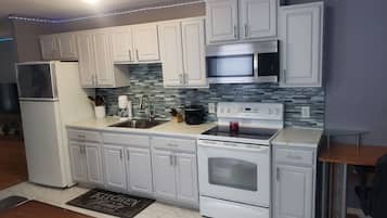 Fridge, microwave, stovetop, coffee/tea maker