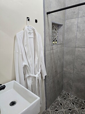 Shower, hair dryer, towels, soap