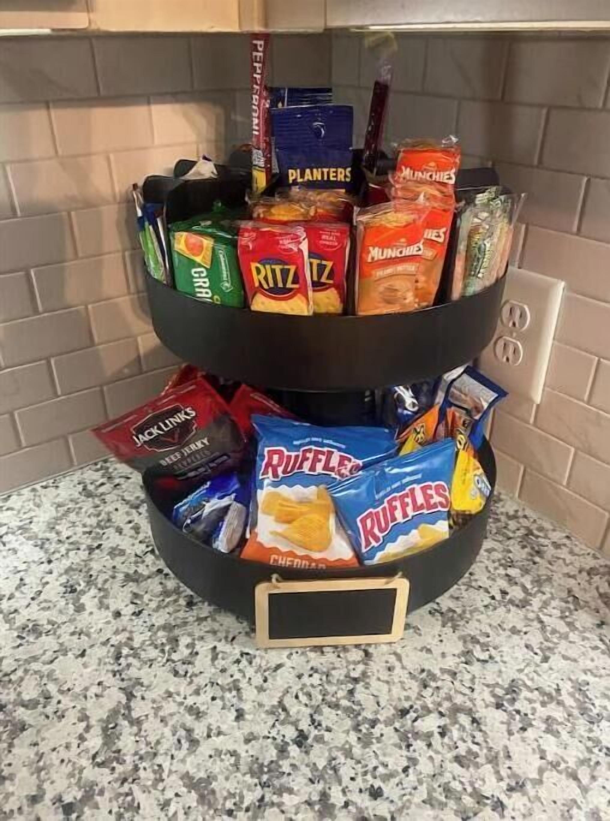 A snack display with various brands like Planters, Ritz, and Ruffles.