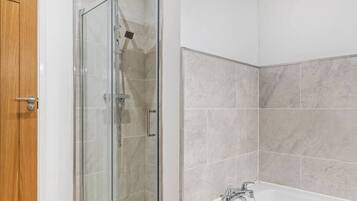 Shower, hair dryer, towels, shampoo