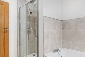 Shower, hair dryer, towels, shampoo
