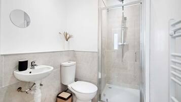 Shower, hair dryer, towels, shampoo