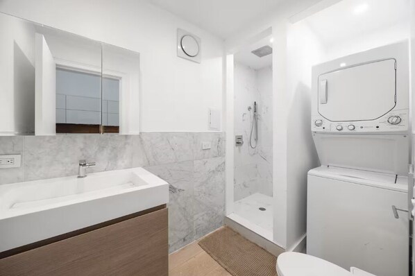 Shower, hair dryer, towels, soap