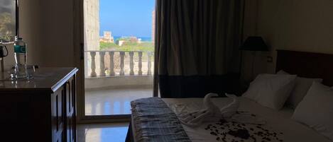 Luxury Double Room, Balcony, Partial Sea View | Egyptian cotton sheets, premium bedding, down comforters