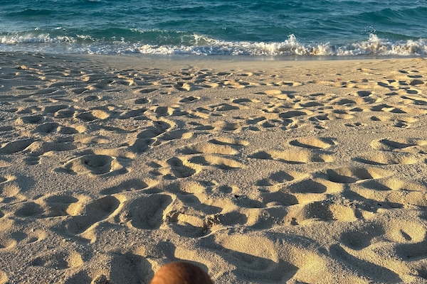 On the beach, white sand, beach towels