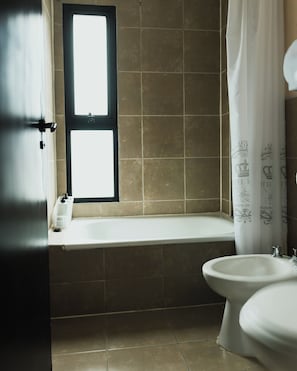 Bidet, towels, soap, toilet paper
