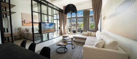 Deluxe Apartment, 3 Bedrooms, Balcony, Pool View | Living area | 42-inch Smart TV with cable channels, Netflix, pay movies