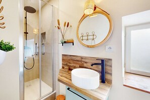 Shower, hair dryer, towels, toilet paper