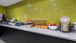A breakfast buffet with various food items and a coffee station. - Red Roof PLUS+ Brooklyn - Flatbush Ave (Brooklyn)