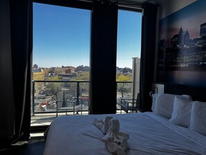 Deluxe Room, Balcony | 1 bedroom, desk, laptop workspace, iron/ironing board