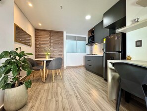Deluxe Studio, 1 Bedroom, Balcony, City View | Private kitchen | Full-size fridge, microwave, stovetop, dishwasher