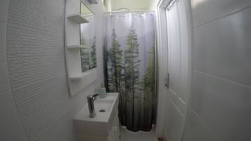 Shower, hair dryer, towels, toilet paper
