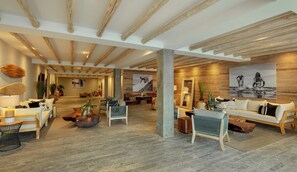 A spacious living area with wooden beams, a sofa set, a coffee table, and a painting on the wall.
