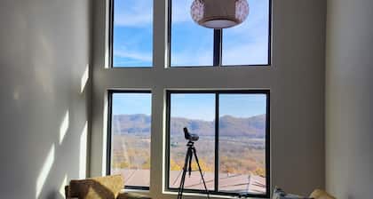 Spacious 5 bedroom modern home with mountain views galore. Sauna + EV charger.