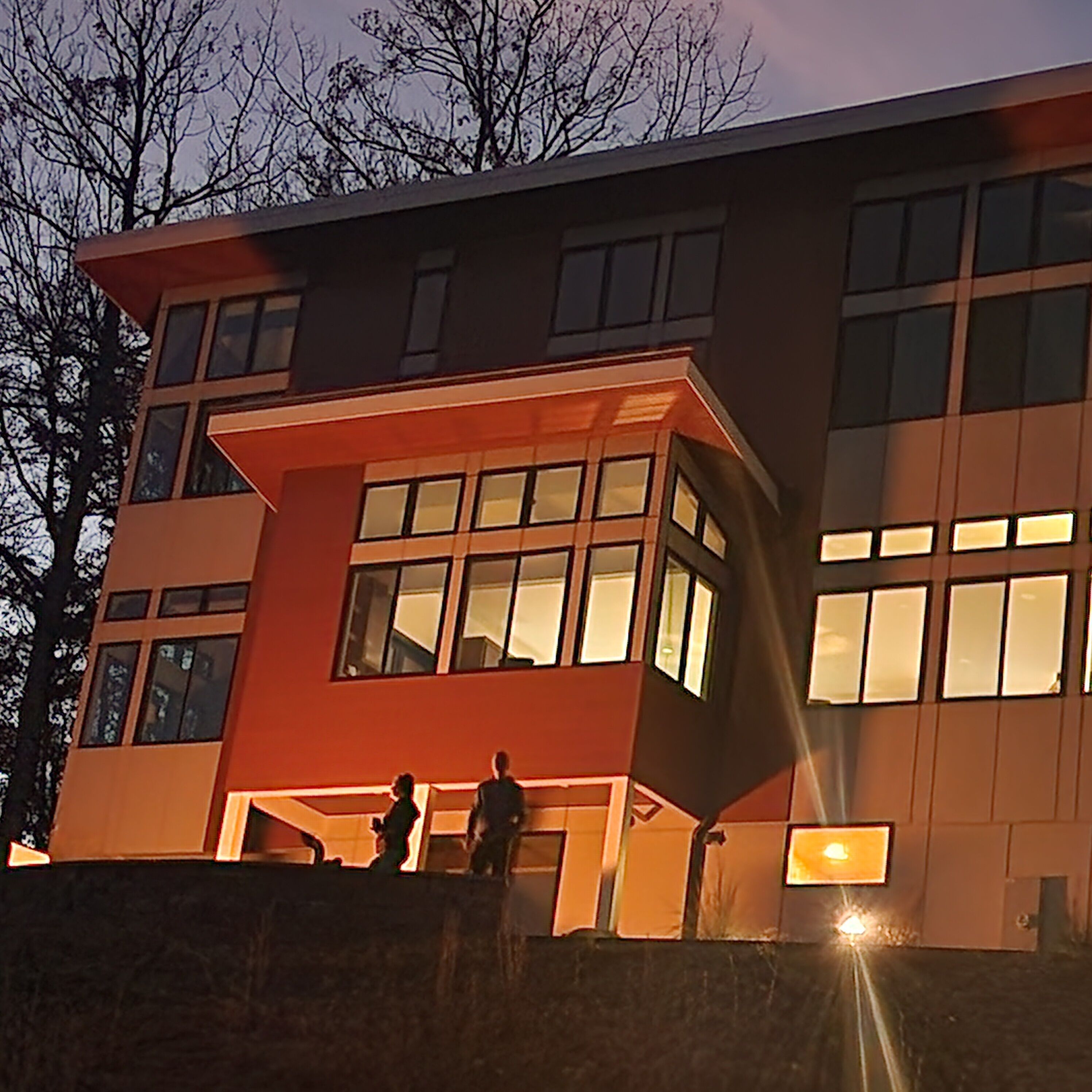 A modern building with large windows and a flat roof.