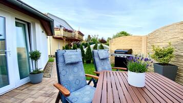 Apartamento | Restaurante al aire libre