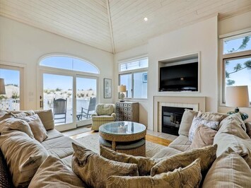 Stylish and inviting living area with abundant seating and a serene atmosphere for relaxation.