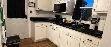 Fridge, microwave, stovetop, coffee/tea maker