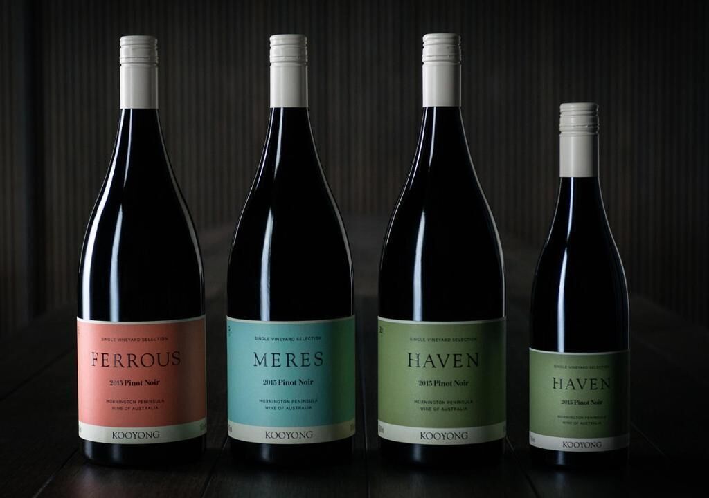 Four wine bottles labeled Ferrous, Meres, Haven, and Haven, each with a white label and a cork.
