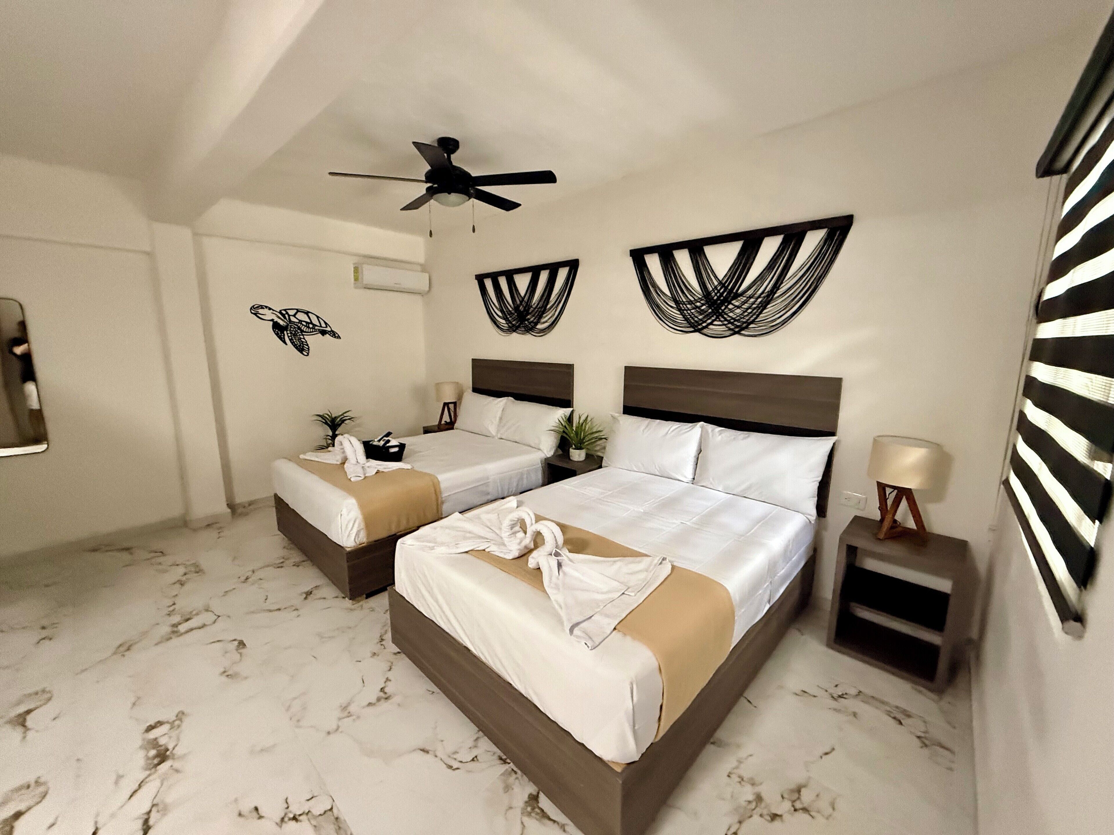 Suite familiar, varias camas, vista al jardín | 1 habitación, wifi gratis y ropa de cama 