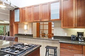 Fridge, oven, coffee/tea maker, cookware/dishes/utensils