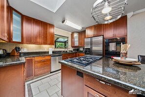 Fridge, oven, coffee/tea maker, cookware/dishes/utensils