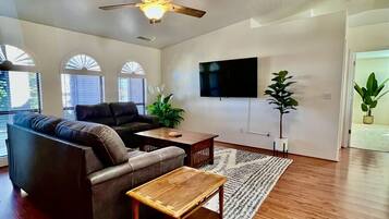Smart TV, fireplace, books, offices