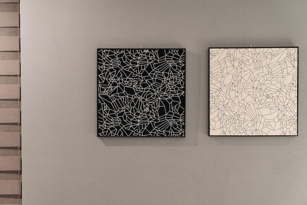 Two framed abstract artworks on a textured wall. - 3s Hotel Soraepogu (Incheon)