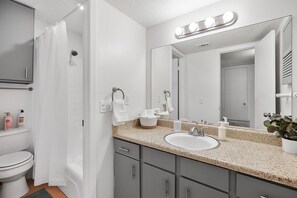 Shower, hair dryer, towels, shampoo