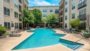 A pool area with lounge chairs and a no diving sign. - SOCO City Views  | Pool + Gym + Racquetball + Laundry + Pkg (Austin)