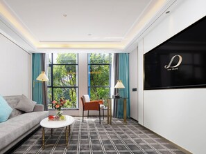 Luxury Suite, City View | Living area | 50-inch Smart TV with cable channels, pay movies, streaming services - Pazhou XANA Deluxe International Hotel Pazhou Convention and Exhibition Center Nanzhou Subway Metro Branch - Free Shuttle Bus to Canton Fair Complex During Canton Fair Period (Guangzhou)