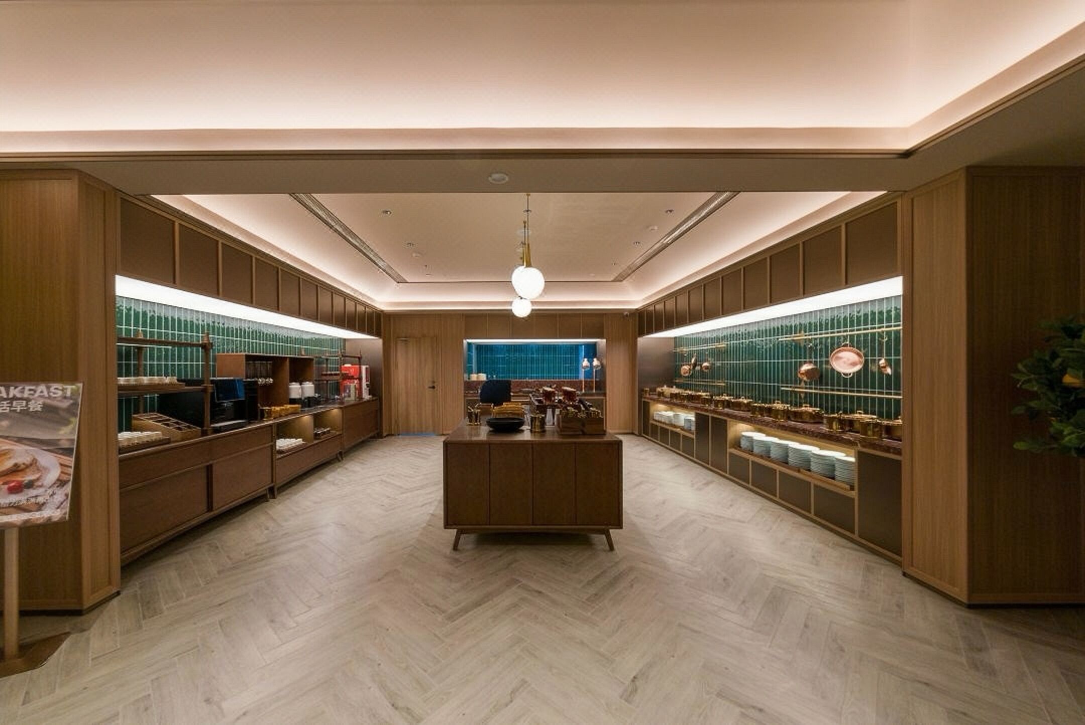 A modern interior with wooden paneling, a central seating area, and display cases on the walls.