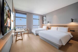 Family Triple Room | Premium bedding, down comforters, memory foam beds, free minibar