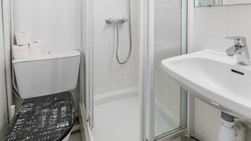Shower, hair dryer, towels, shampoo