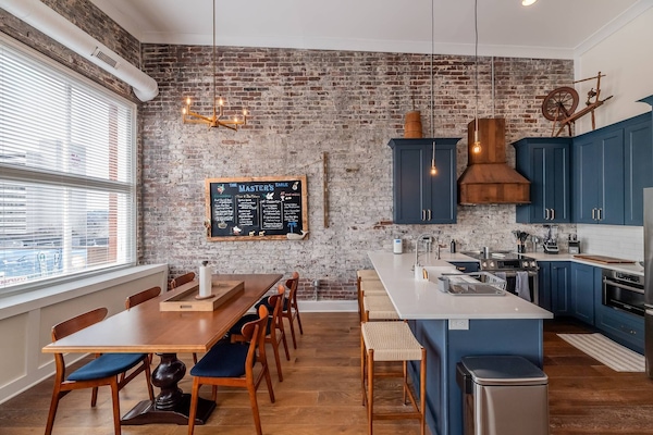 The open concept kitchen and dining area with ample seating invites you to sit and enjoy those home cooked meals