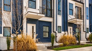 A modern townhouse with a brick facade, large windows, and a well-maintained front yard. - Monty by AvantStay | 4BDR 4BA | Balcony + Outdoor Seating | Minutes to Downtown (Nashville)