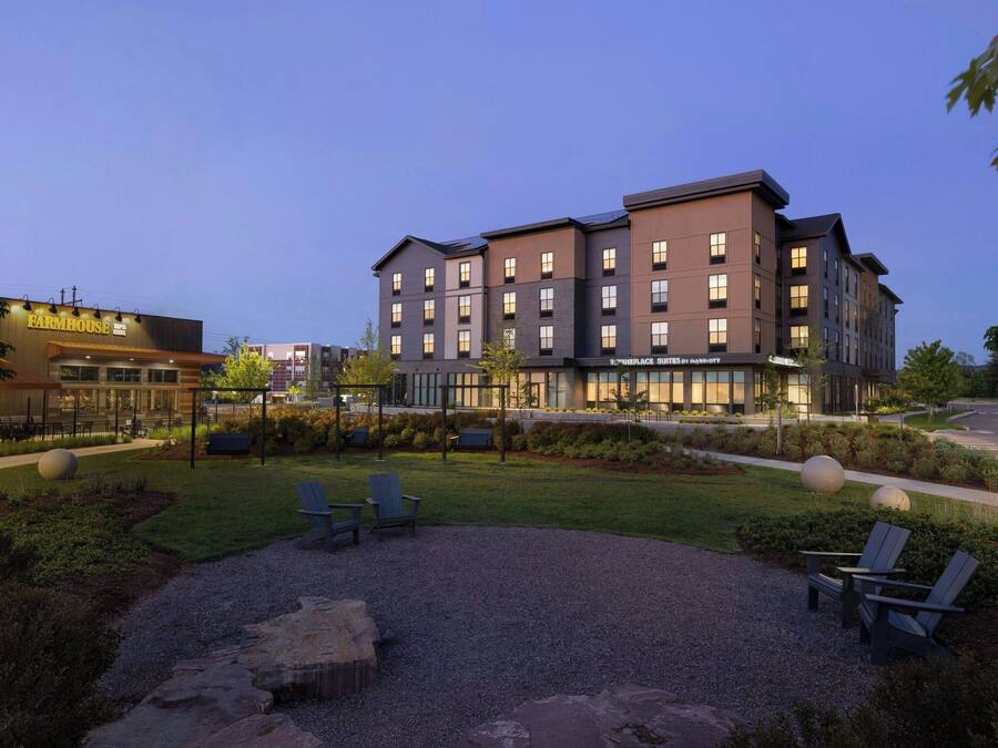 A multi-story building with a modern architectural design, featuring a mix of residential and commercial spaces.